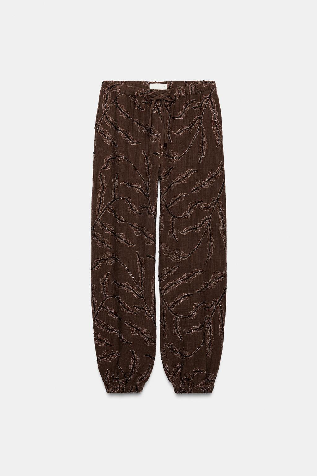 ШАРОВАРЫ ИЗ МЕТАЛЛИЗИРОВАННОЙ ТКАНИ С ПАЙЕТКАМИ