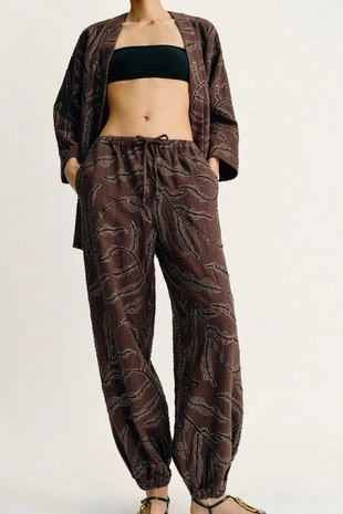 Шаровары из металлизированной ткани с пайетками- Заказать в России