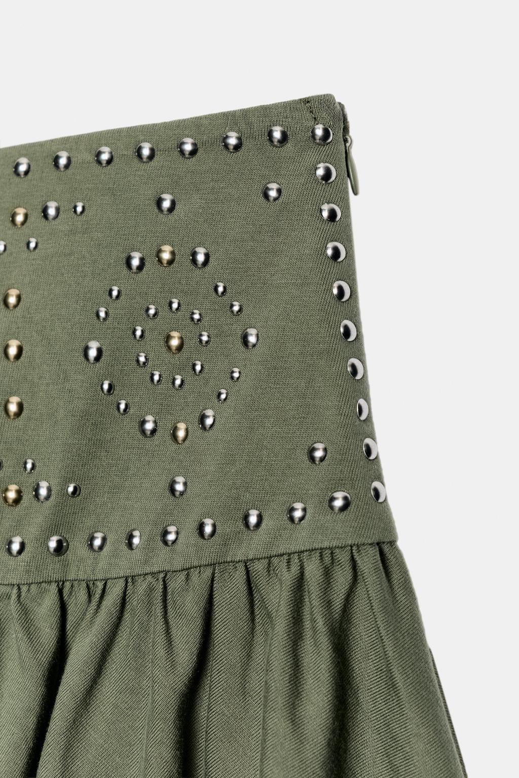 ЮБКА АСИММЕТРИЧНОГО КРОЯ С ЗАКЛЕПКАМИ