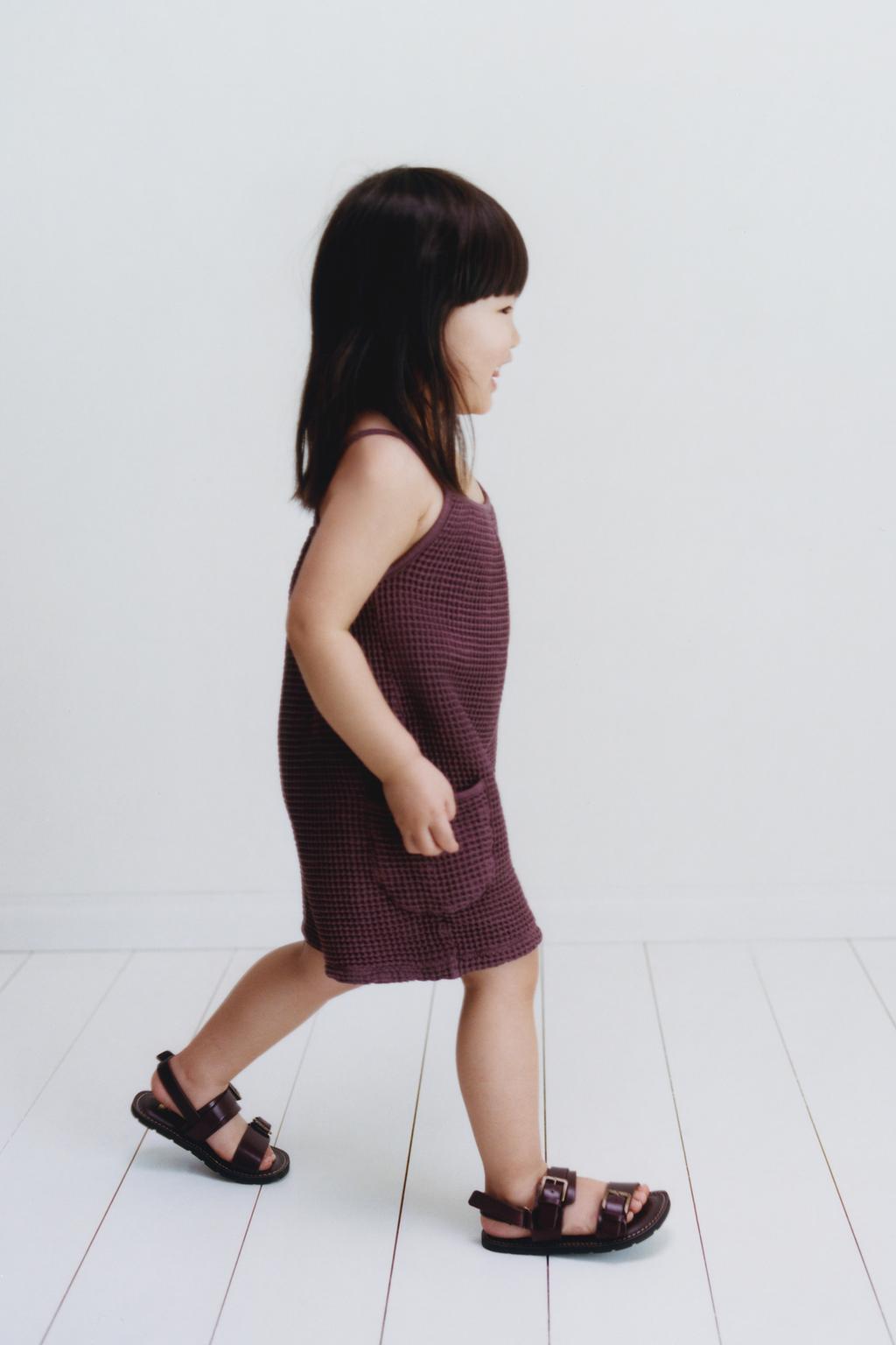 КОРОТКИЙ КОМБИНЕЗОН ИЗ РИФЛЕНОЙ ТКАНИ С БАНТАМИ