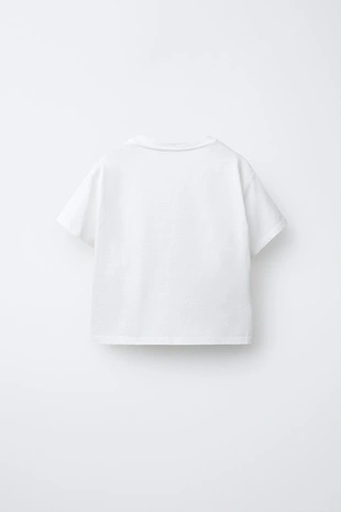 Футболка с органзовыми цветами- Заказать в России