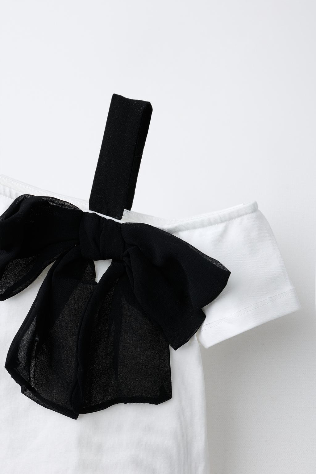 Футболка с луком на верху