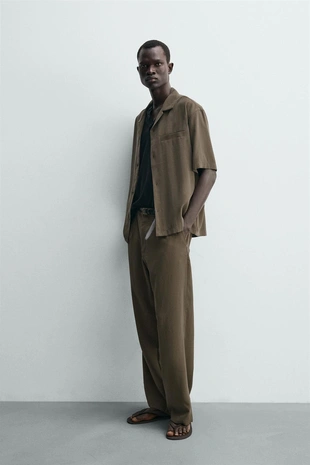 Струящиеся брюки Relaxed Fit- Заказать в России