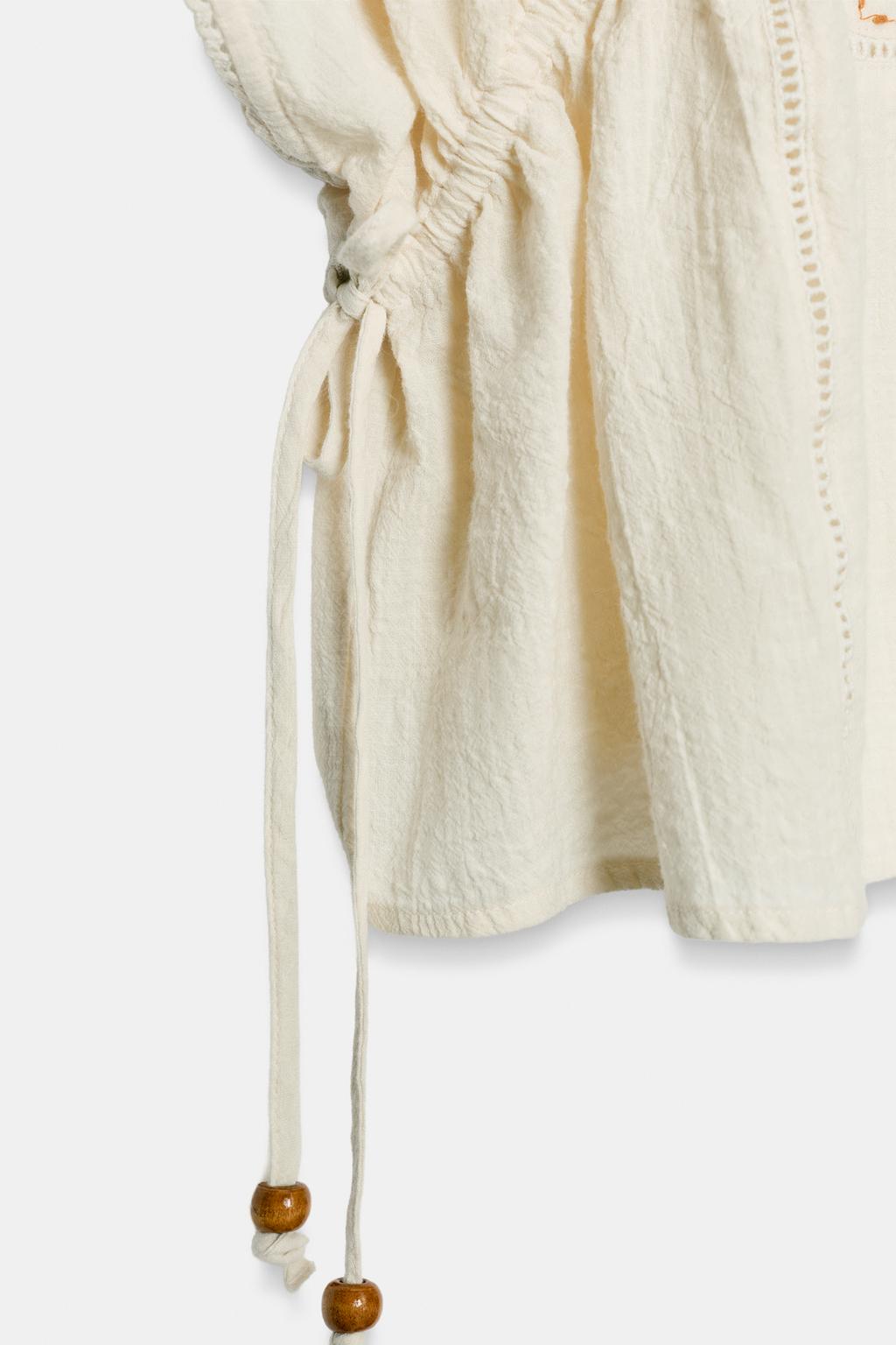 ТОП С ВЫШИВКОЙ И БОКОВЫМИ ШНУРОВКАМИ