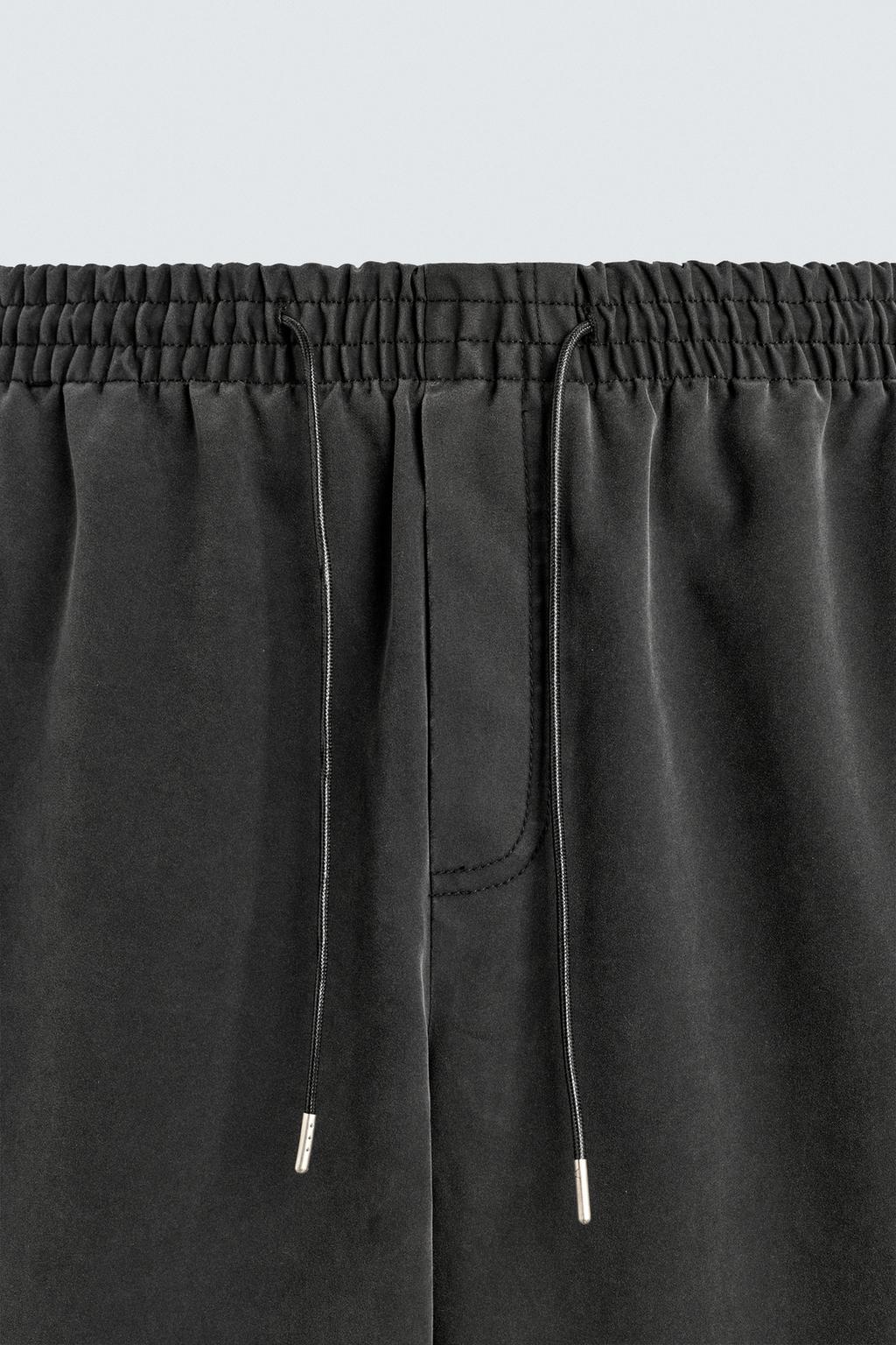 БРЮКИ RELAXED FIT ИЗ ИСКУССТВЕННОЙ КОЖИ С ЗАКЛЕПКАМИ