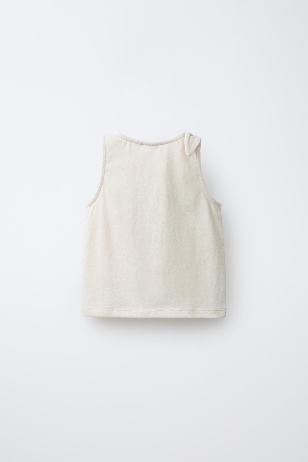 ФУТБОЛКА С УЗЛОМ И ТРОПИЧЕСКОЙ ВЫШИВКОЙ