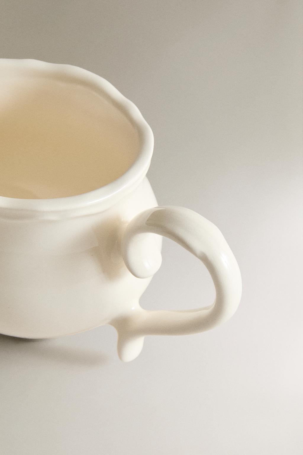 Молочник из тонкой фарфоровой глины с цветочным рисунком