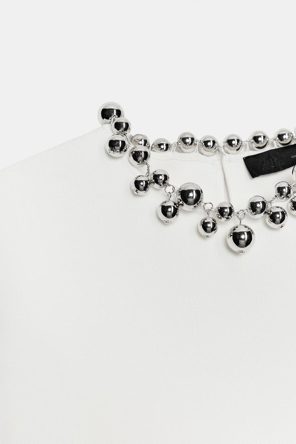 ТРИКОТАЖНЫЙ ТОП С БУСИНАМИ