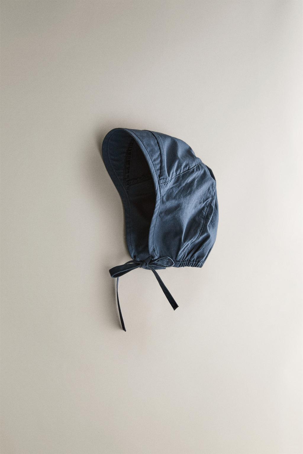 Солнечная шапочка для малышей на пляже