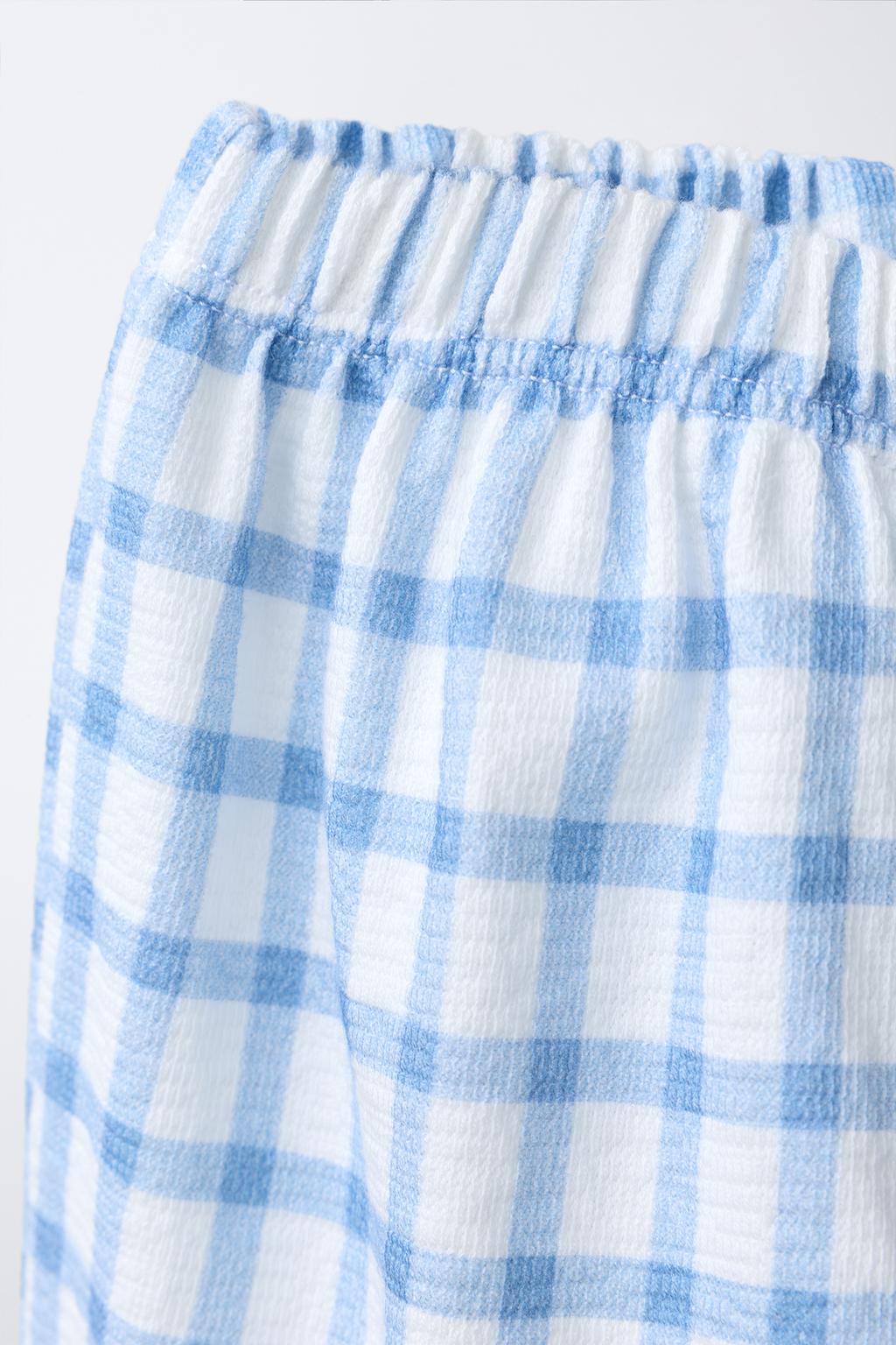 БРЮКИ В КЛЕТКУ С КАРМАНАМИ