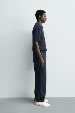 Поло из рельефного трикотажа с косами