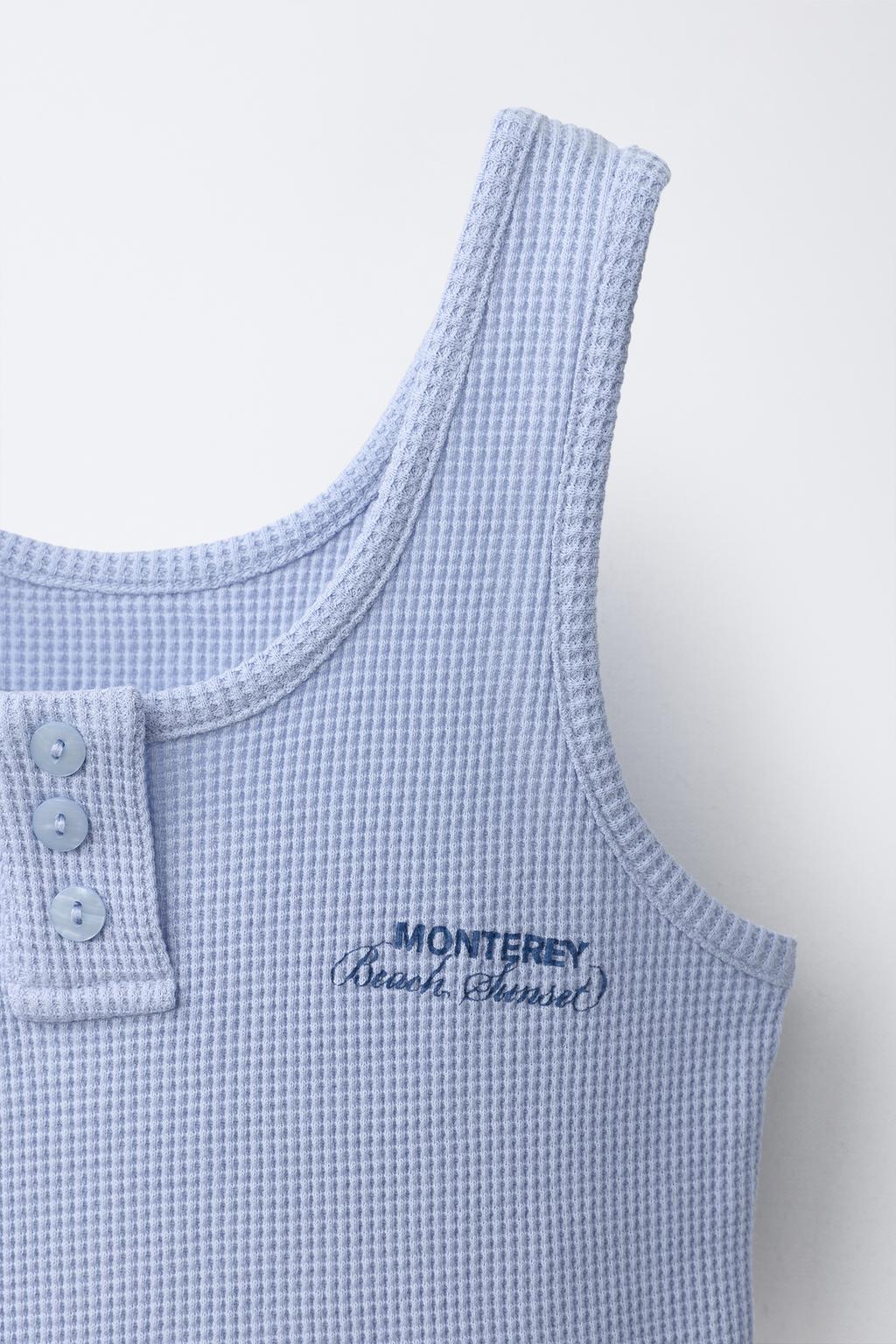 ТОП ИЗ РИФЛЕНОГО ТРИКОТАЖА С НАДПИСЬЮ