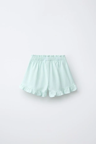 Шорты с воланами и тропическим принтом- Заказать в России