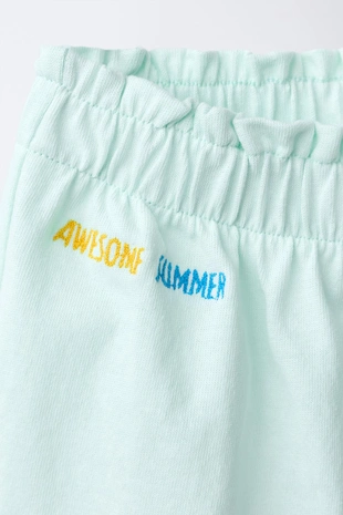 Шорты с воланами и тропическим принтом- Заказать в России