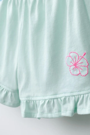 Шорты с воланами и тропическим принтом- Заказать в России