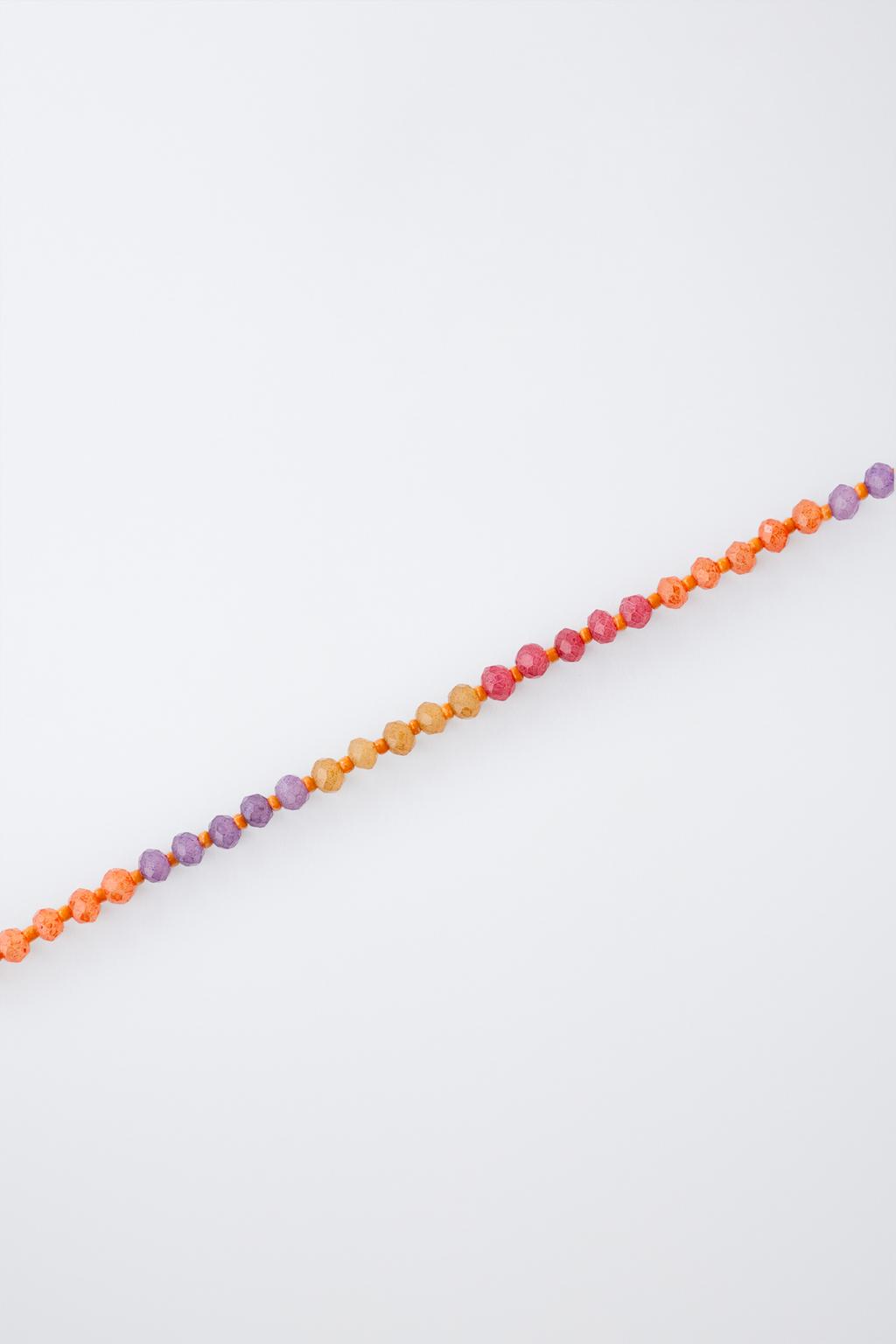 Набор из двух бус и колье с подвеской в виде солнца