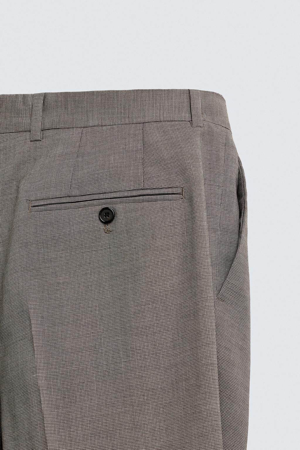 БРЮКИ КОСТЮМНЫЕ В КЛЕТКУ СО СКЛАДКАМИ