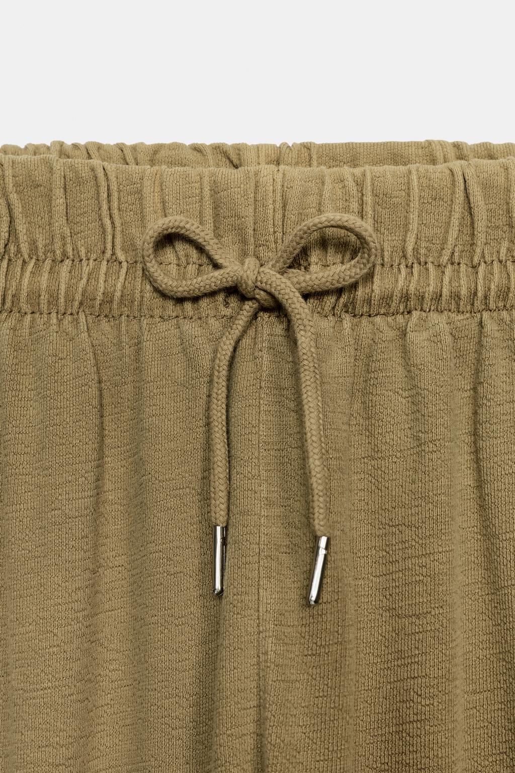 БРЮКИ С ЭФФЕКТОМ ПОТЕРТОСТИ