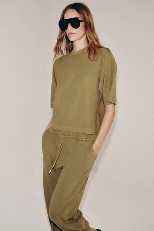 Брюки с эффектом потертости- Заказать в России