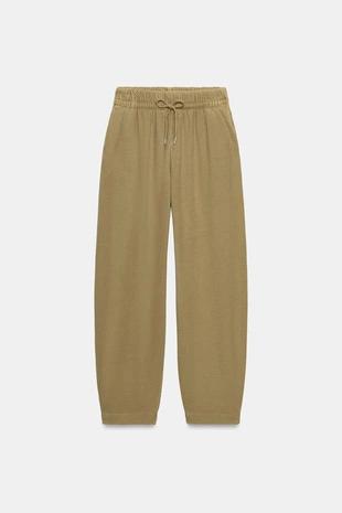 Брюки с эффектом потертости- Заказать в России