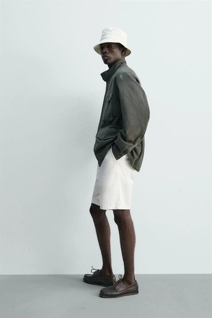 Куртка с эффектом потертости и накладными карманами