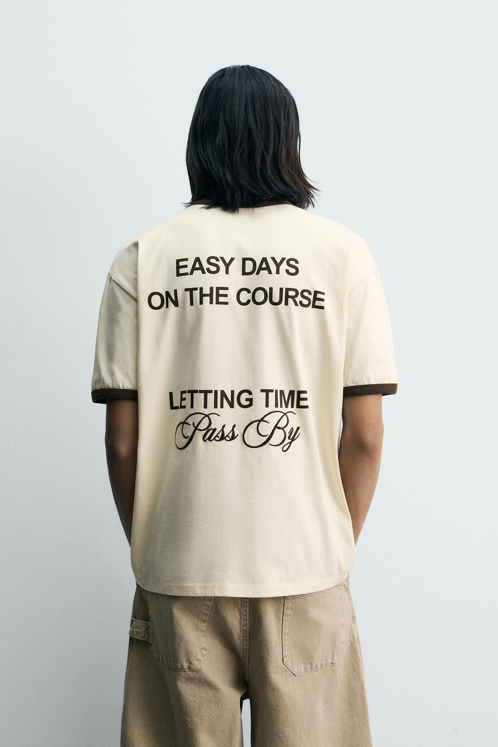 ФУТБОЛКА В РУБЧИК С КОНТРАСТНЫМИ НАДПИСЯМИ