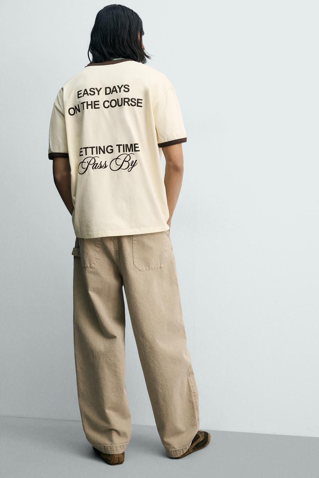 ФУТБОЛКА В РУБЧИК С КОНТРАСТНЫМИ НАДПИСЯМИ