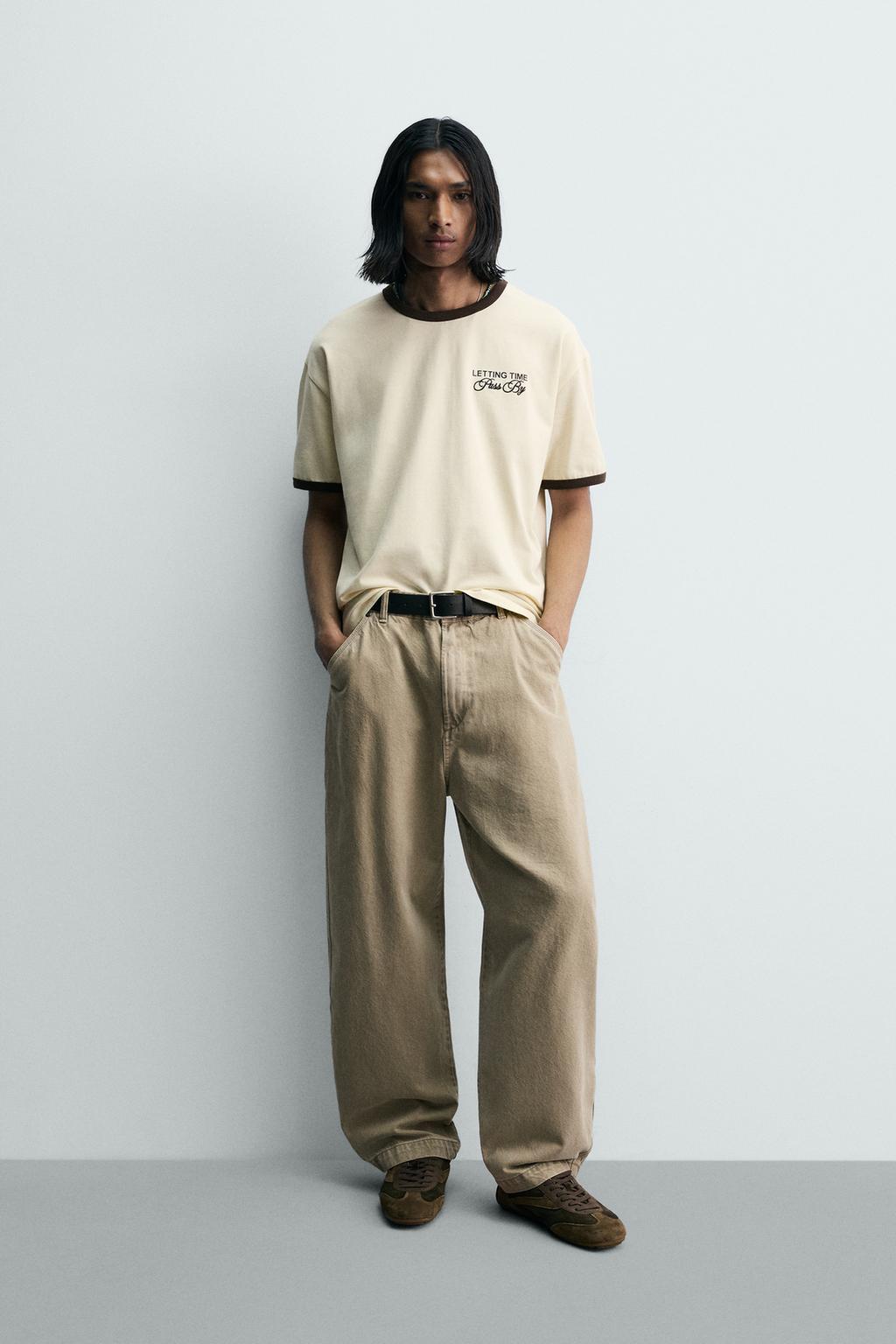 ФУТБОЛКА В РУБЧИК С КОНТРАСТНЫМИ НАДПИСЯМИ