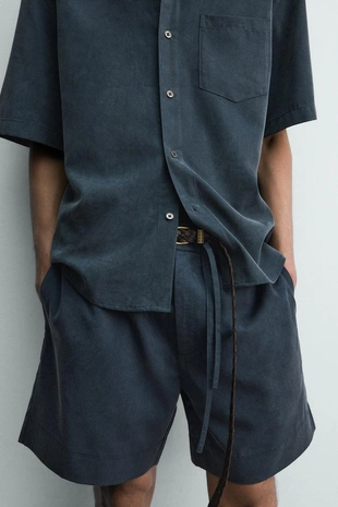 Шорты  с эффектом потертости- Заказать в России