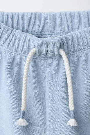 Комплект из футболки и шортов из махровой ткани- Заказать в России