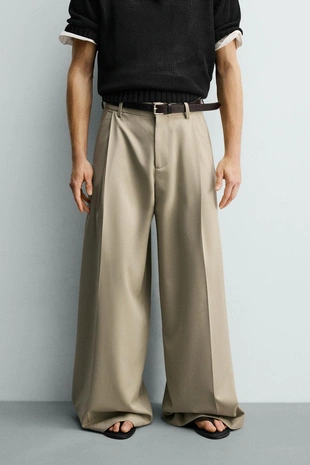 Брюки свободного кроя со складками- Заказать в России