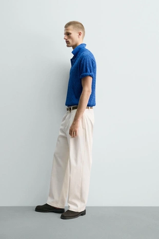 Поло из рельефного трикотажа с косами- Заказать в России