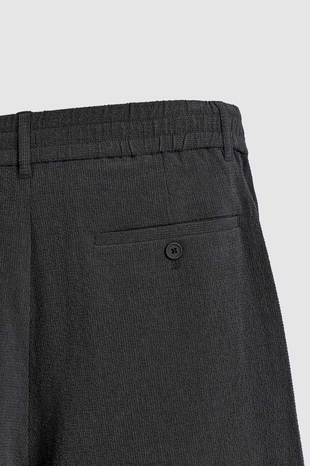 ШОРТЫ СВОБОДНОГО КРОЯ С НЕРОВНОЙ ТЕКСТУРОЙ И СКЛАДКАМИ