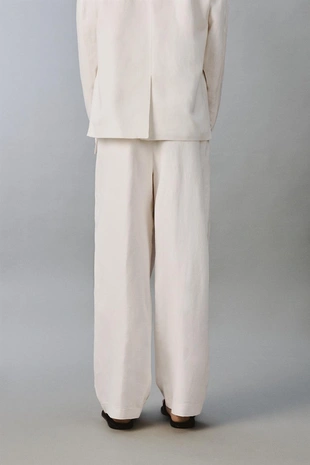 Костюмные брюки свободного кроя из вискозы и льна- Заказать в России