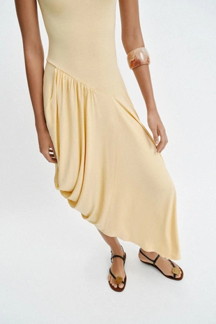 Длинное платье асимметричного кроя- Заказать в России