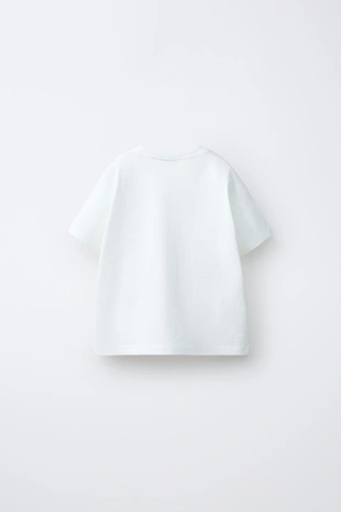 Футболка с карманом и воланами