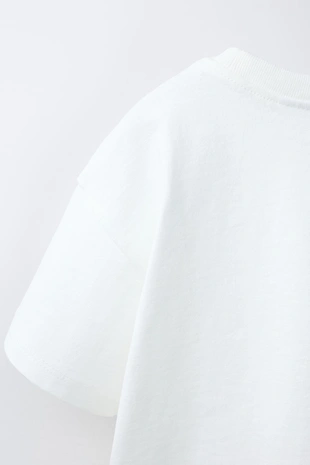 Футболка с карманом и воланами