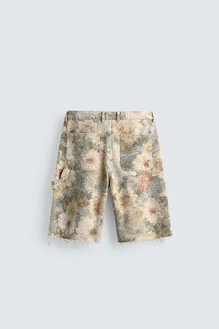Шорты Relaxed Fit с цветочным принтом и эффектом потертости- Заказать в России