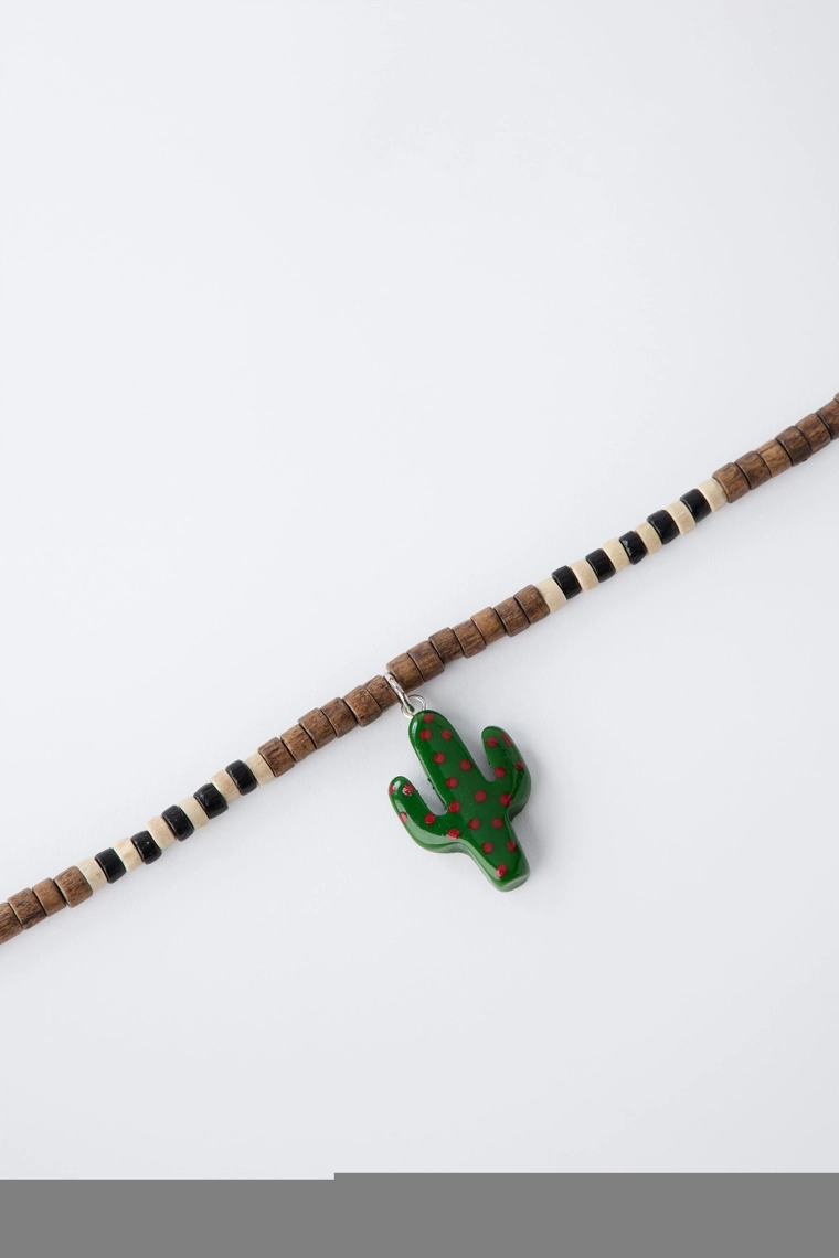 Набор из двух деревянных бусинных ожерелий с куликом