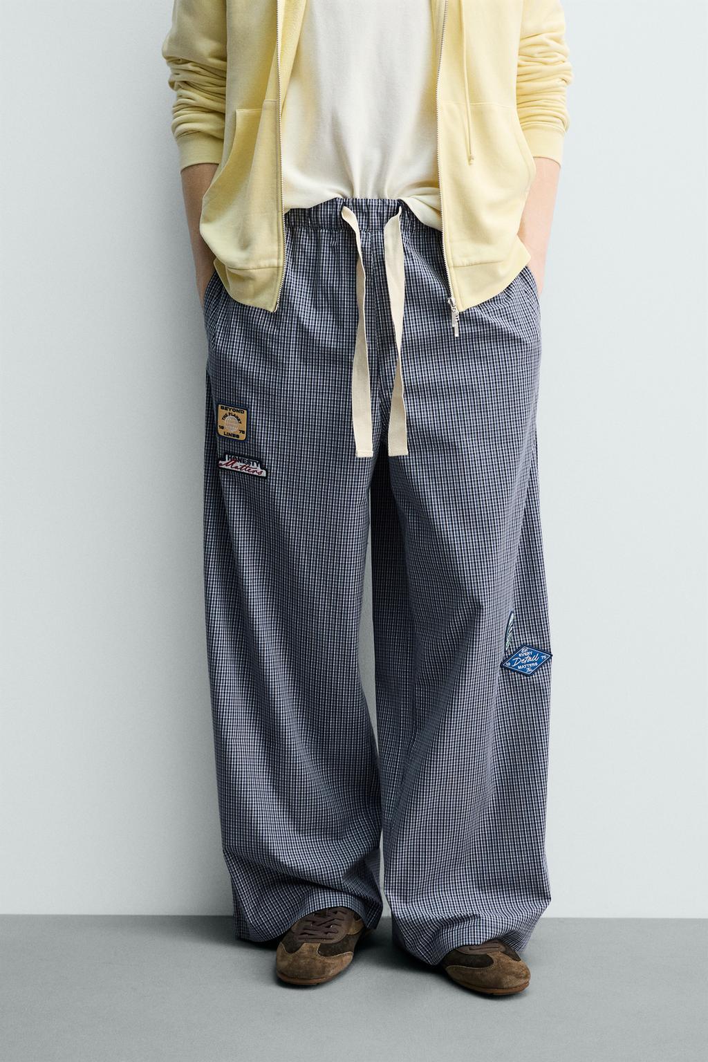 БРЮКИ RELAXED FIT В КЛЕТКУ С НАШИВКАМИ