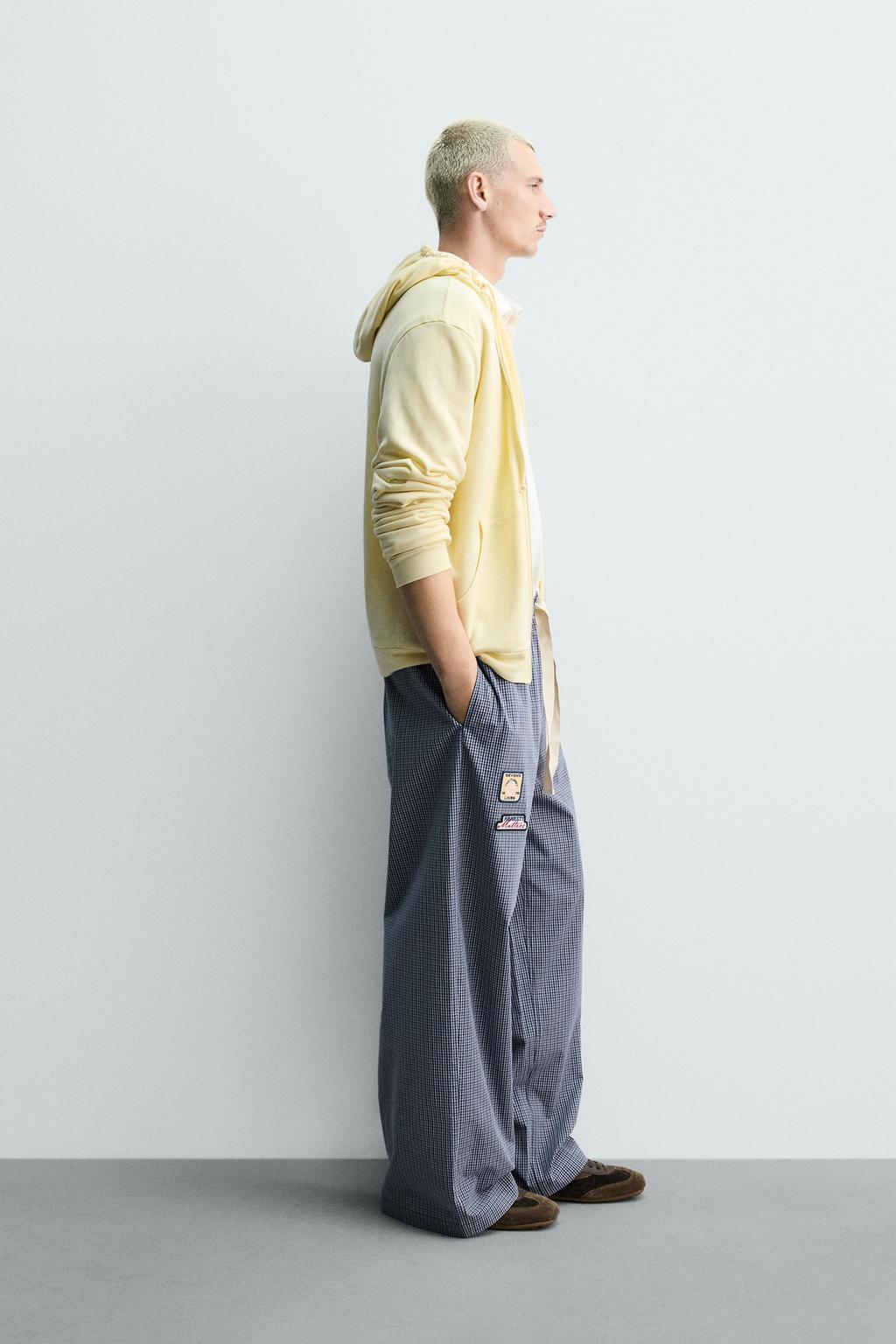 БРЮКИ RELAXED FIT В КЛЕТКУ С НАШИВКАМИ