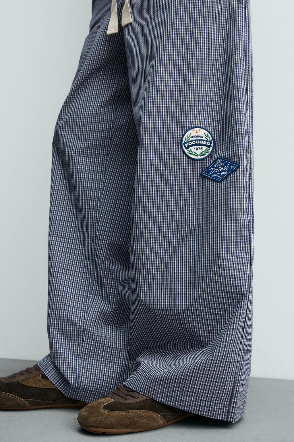 БРЮКИ RELAXED FIT В КЛЕТКУ С НАШИВКАМИ