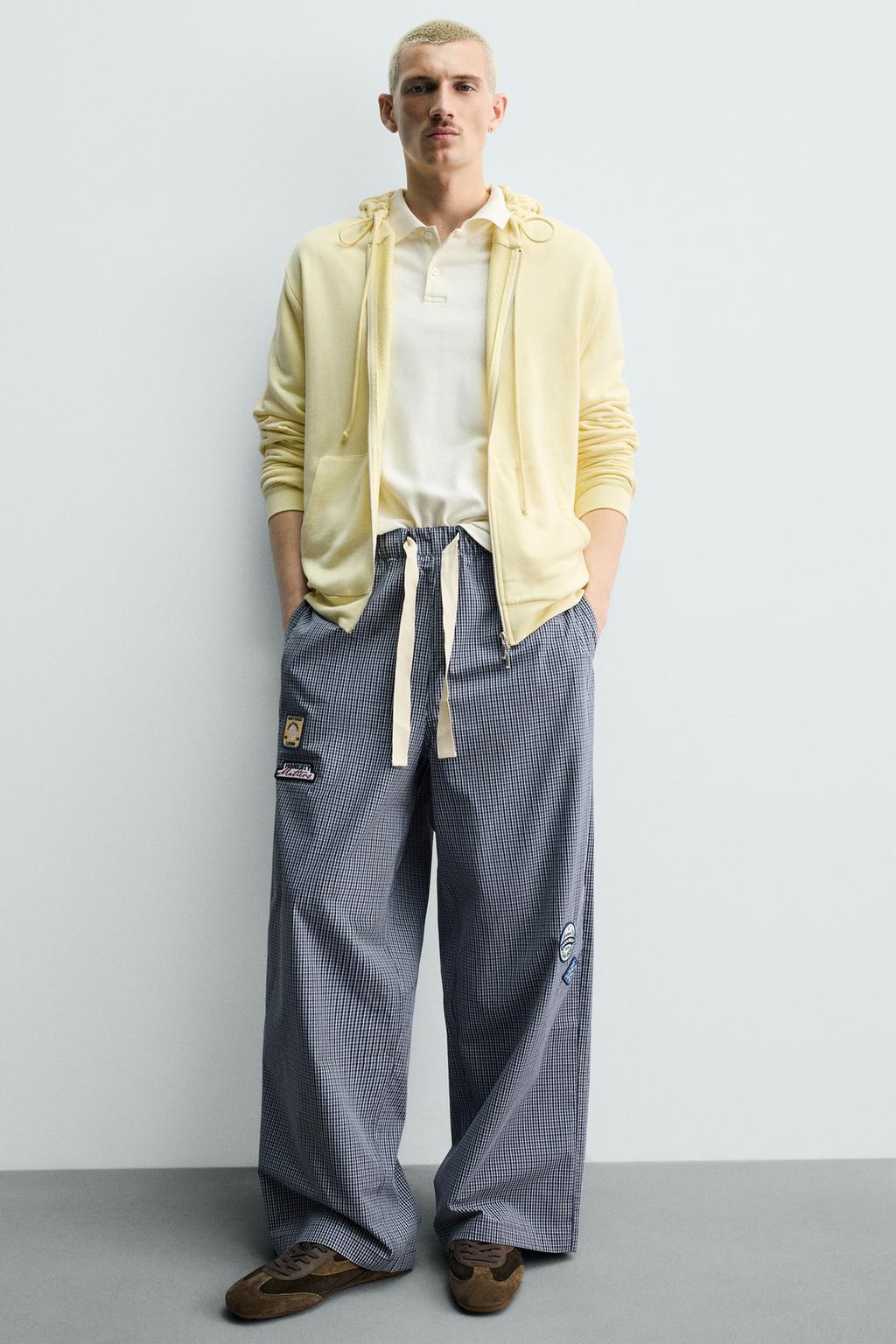 БРЮКИ RELAXED FIT В КЛЕТКУ С НАШИВКАМИ