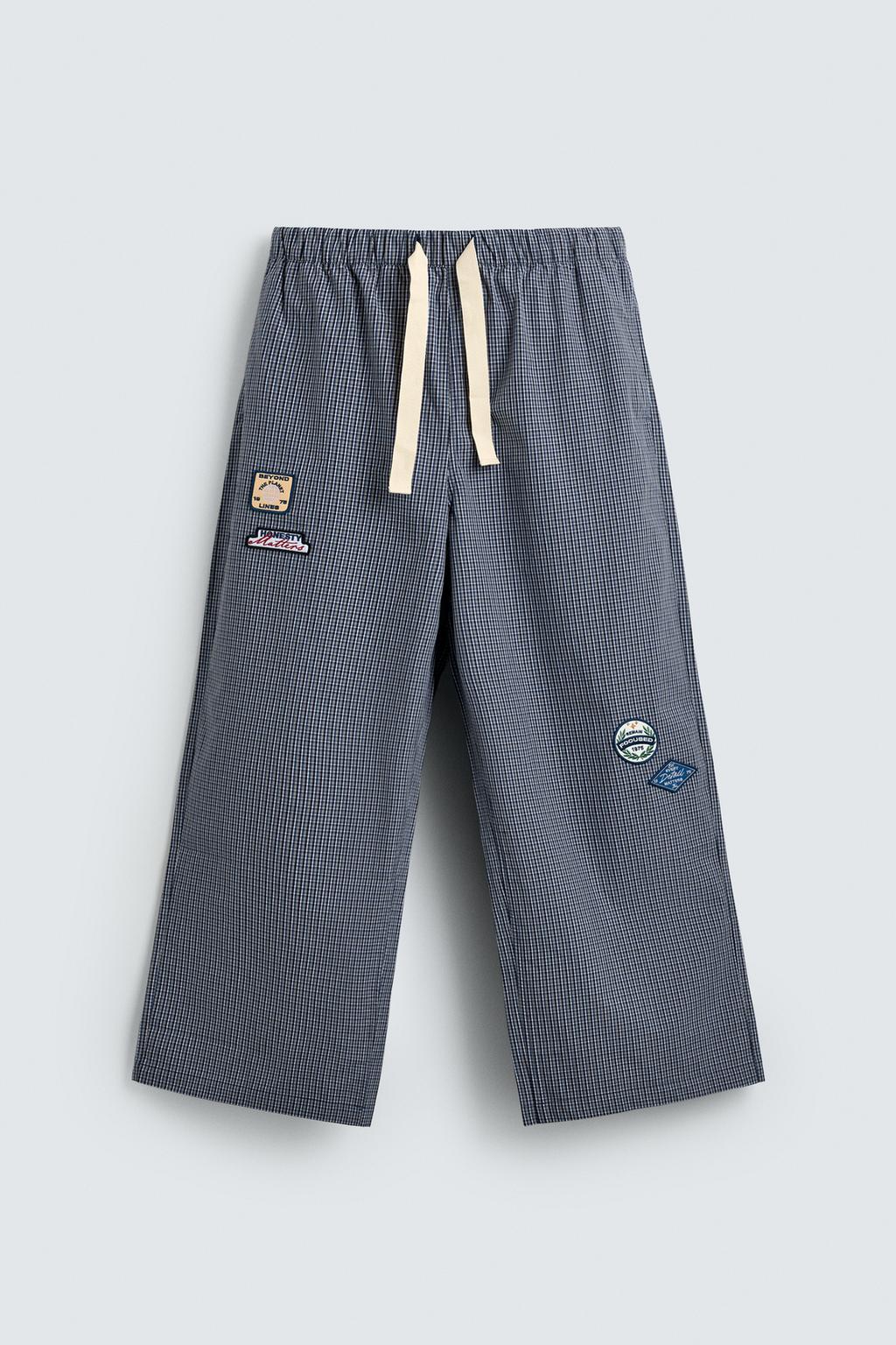 БРЮКИ RELAXED FIT В КЛЕТКУ С НАШИВКАМИ