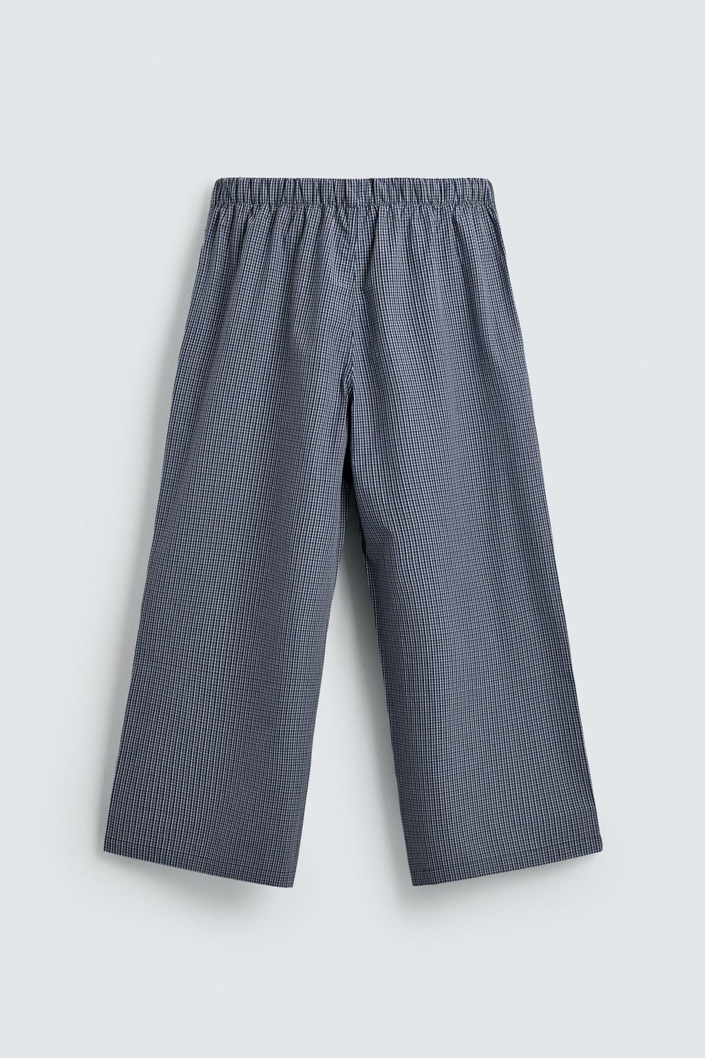 БРЮКИ RELAXED FIT В КЛЕТКУ С НАШИВКАМИ