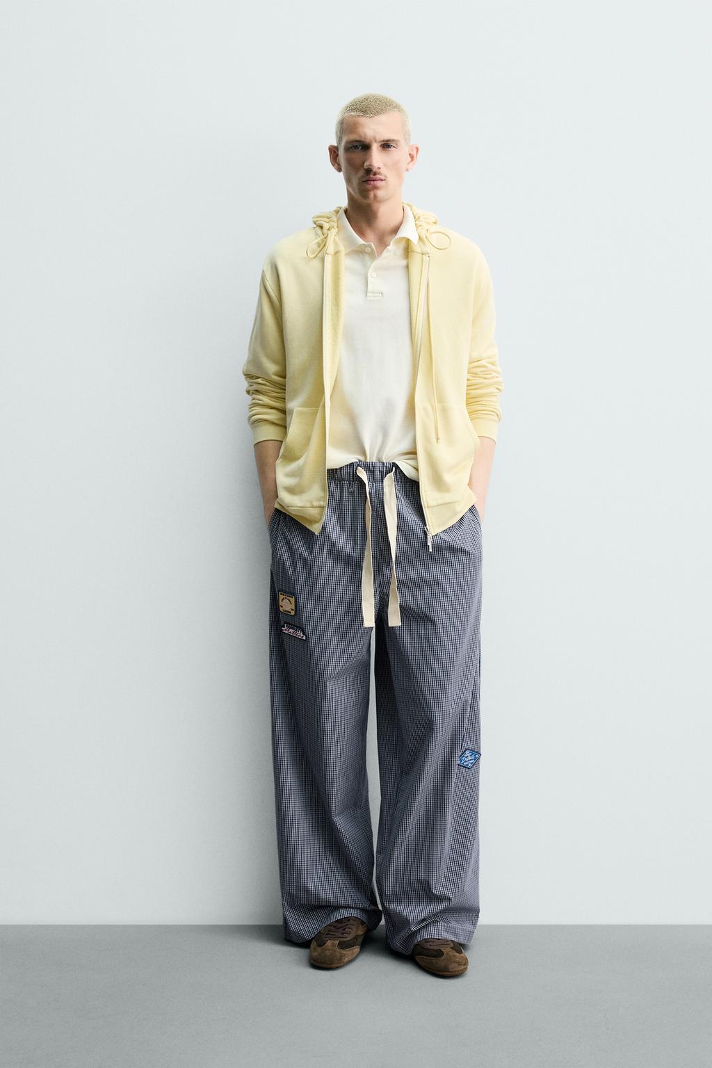 БРЮКИ RELAXED FIT В КЛЕТКУ С НАШИВКАМИ