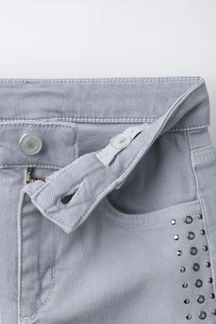 Джинсы Bootcut с заклепками- Заказать в России