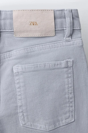 Джинсы Bootcut с заклепками- Заказать в России