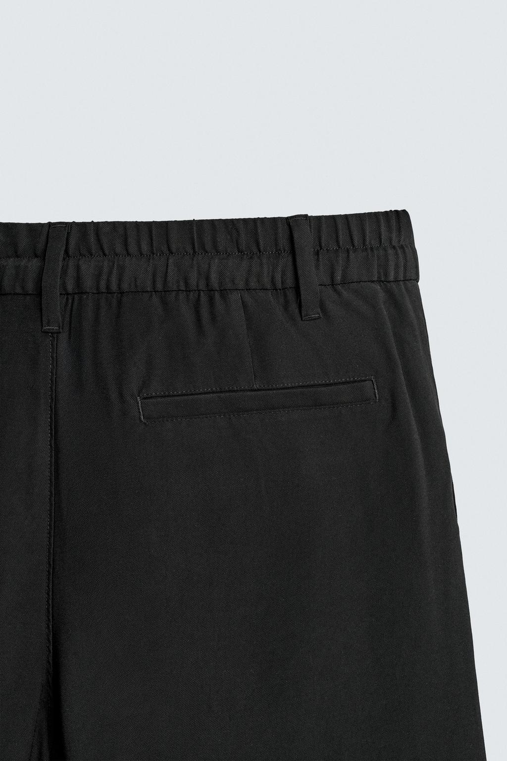 СТРУЯЩИЕСЯ БРЮКИ RELAXED FIT СО СКЛАДКАМИ