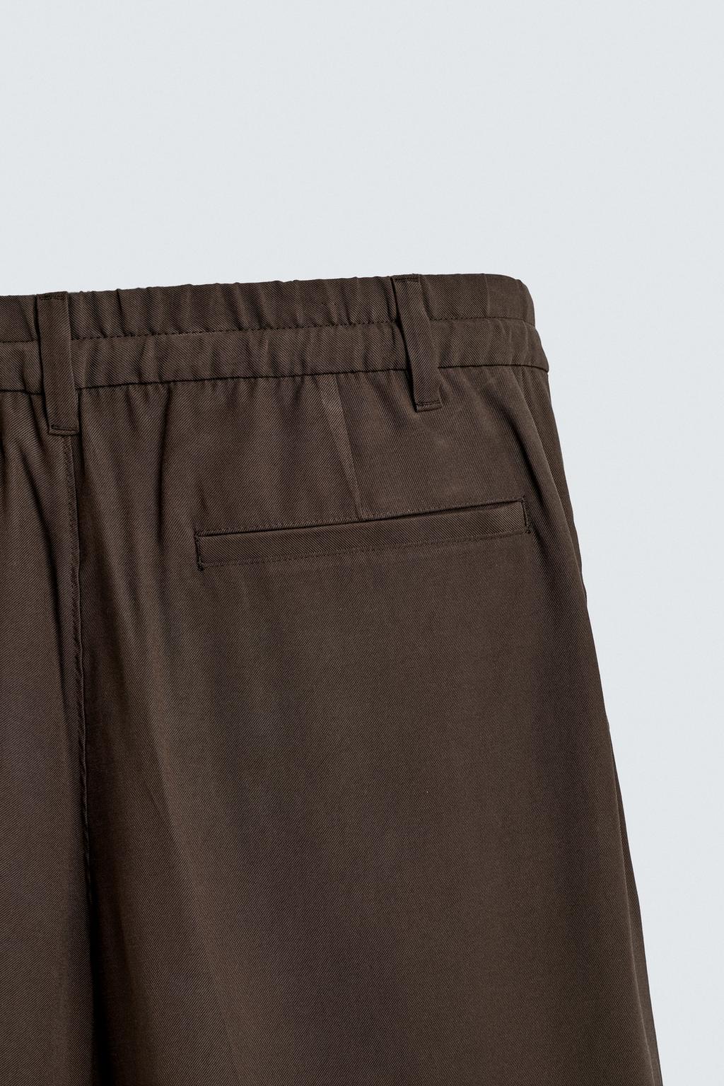 СТРУЯЩИЕСЯ БРЮКИ RELAXED FIT СО СКЛАДКАМИ
